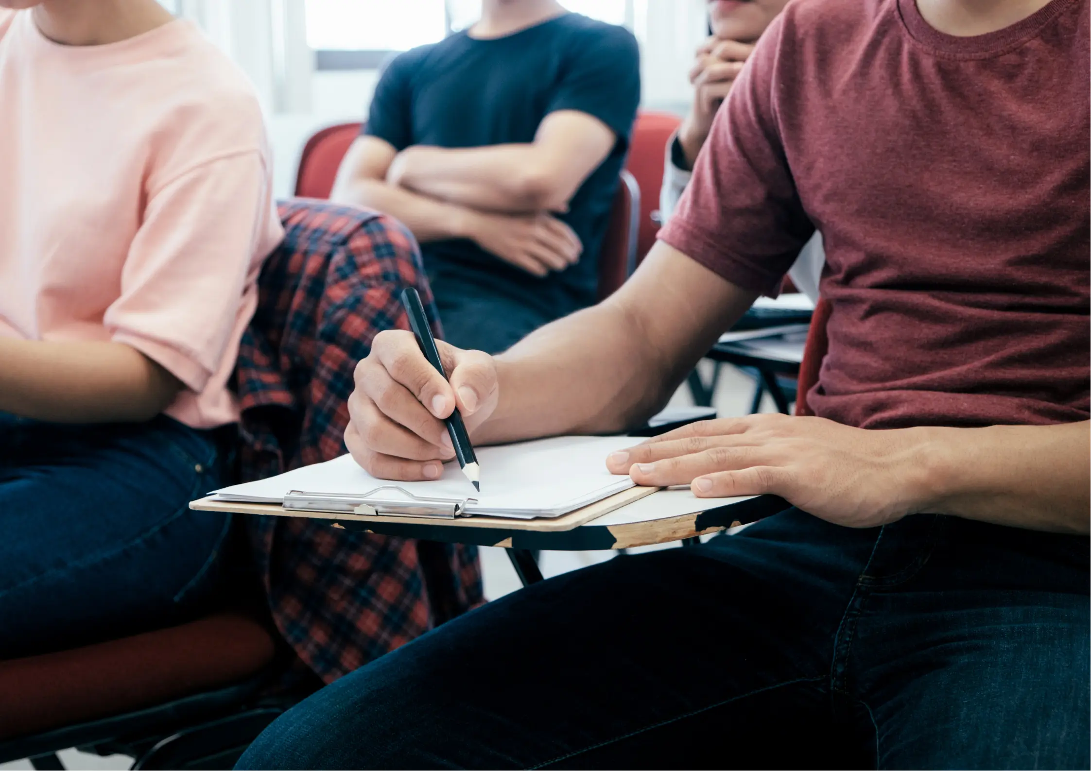 Young adults participating in structured life skills workshop and group discussion at Better Steps Life Skills Center, learning workplace readiness and career preparation skills
