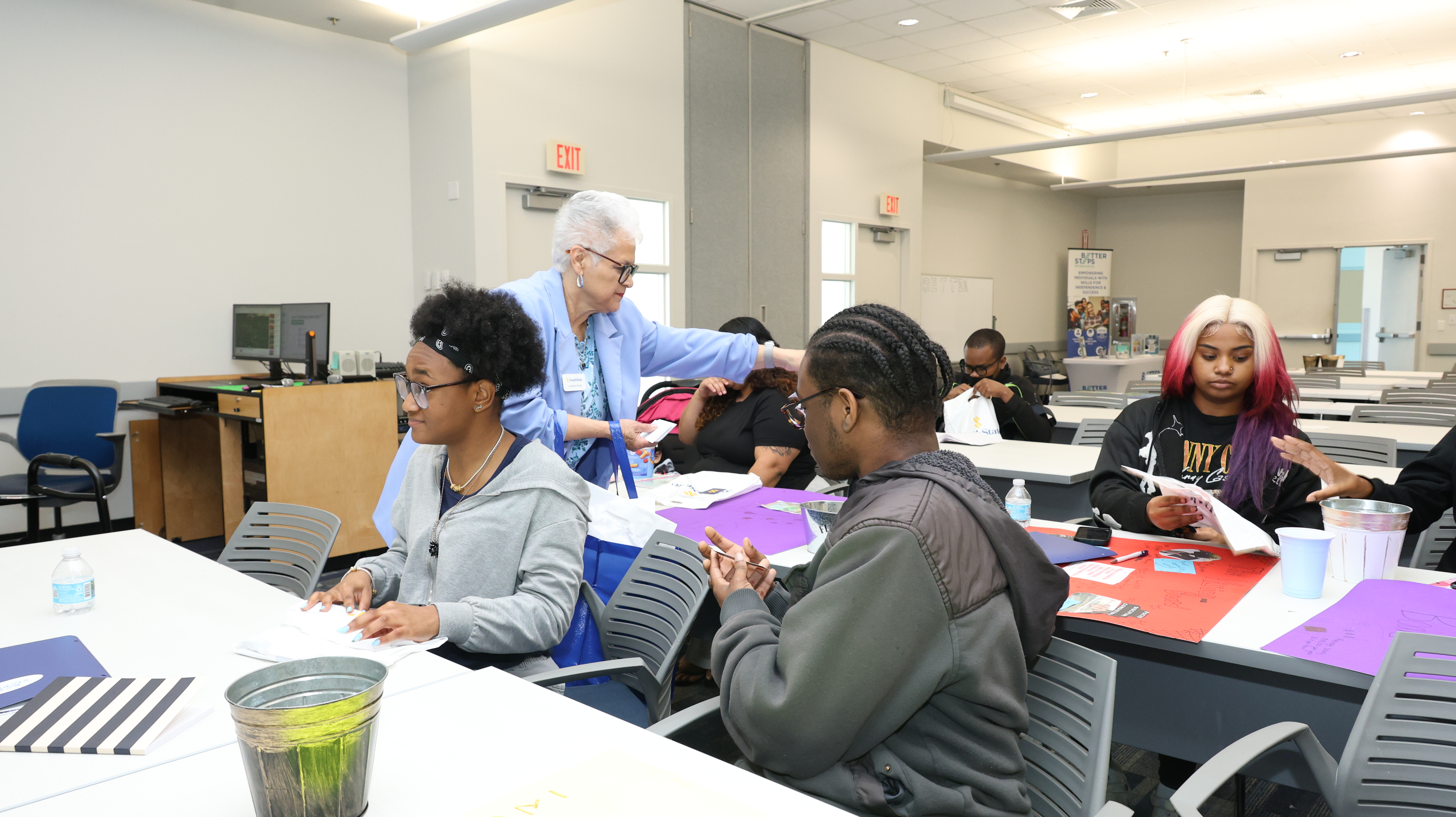 Better Steps Life Skills Center instructors guiding special needs youth through job skill development.