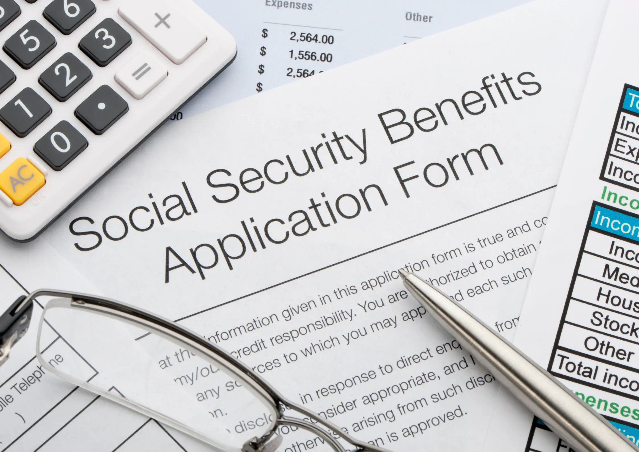 Social Security benefits application form with a calculator and expense worksheet for financial support.