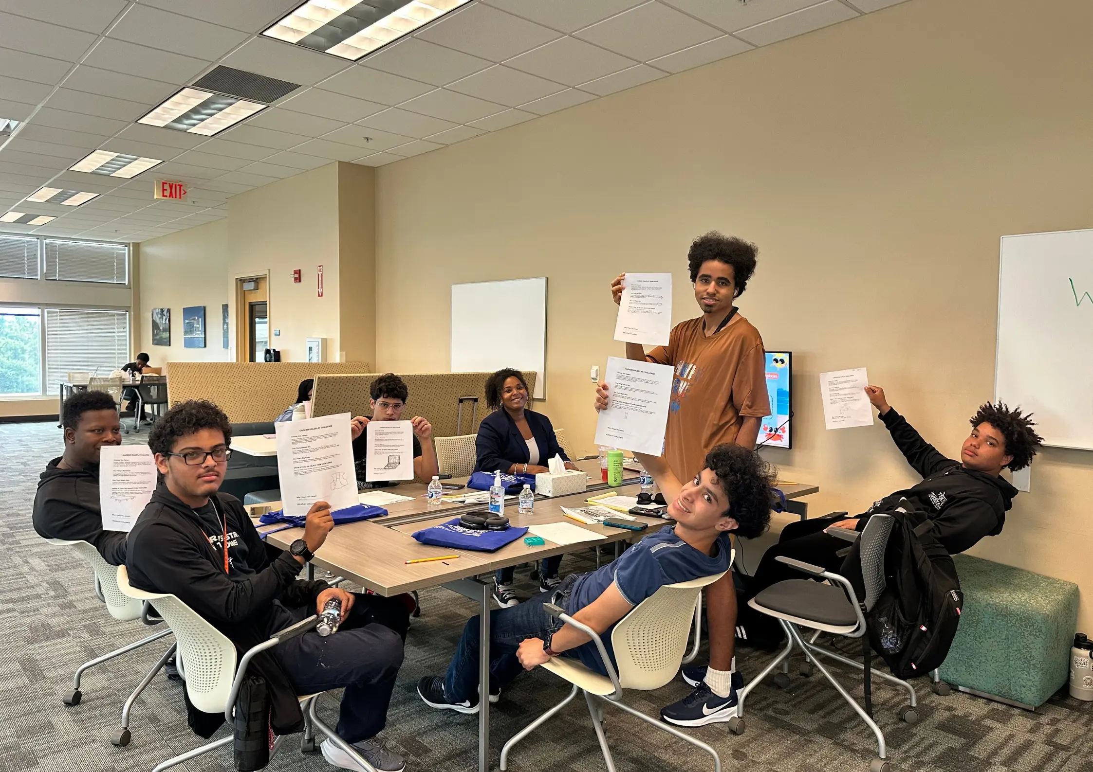 Students holding completed training certificates during a Florida Vocational Rehabilitation career camp at Better Steps Life Skills Center.