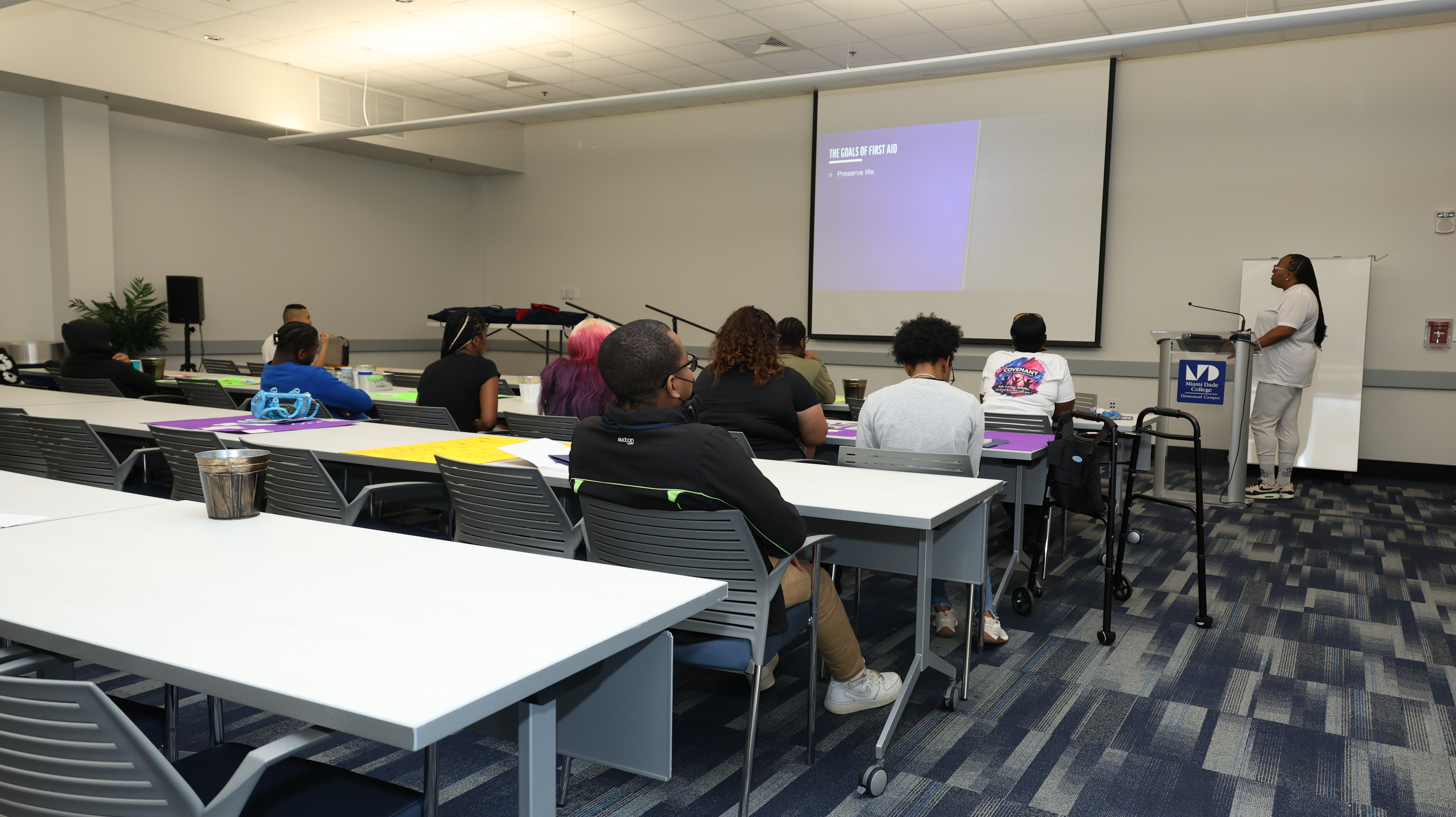 Students attending a free life skills curriculum workshop on safety and first aid at Better Steps Life Skills Center.