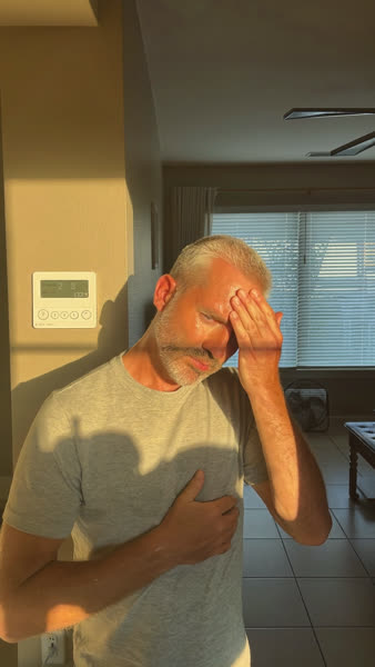 Example static ad: a man sweating in an overheated living room next to the thermostat.