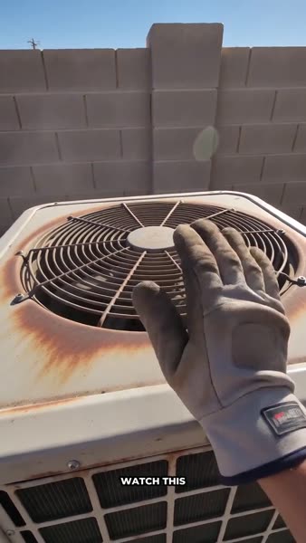Example video ad: a gloved hand on an old, rusted AC unit, before a new one is installed.