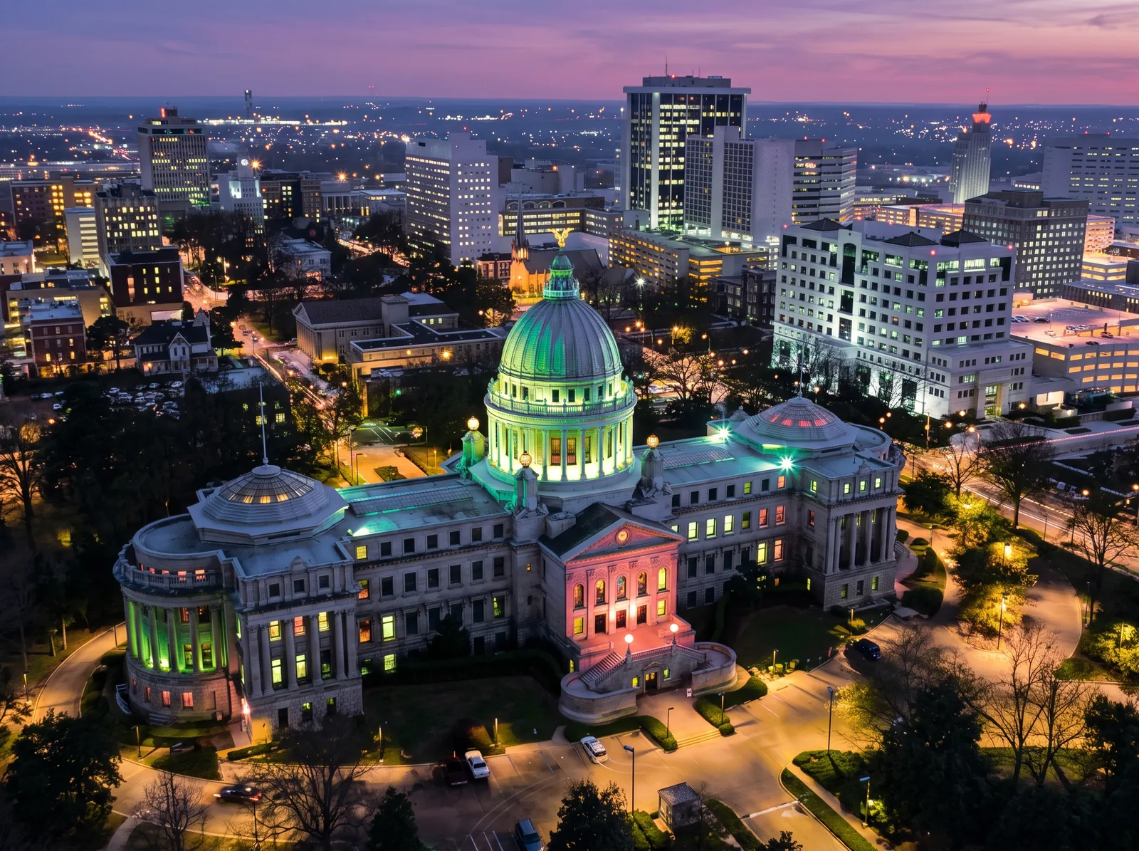 Mississippi State Capitol lit up at dusk in downtown Jackson