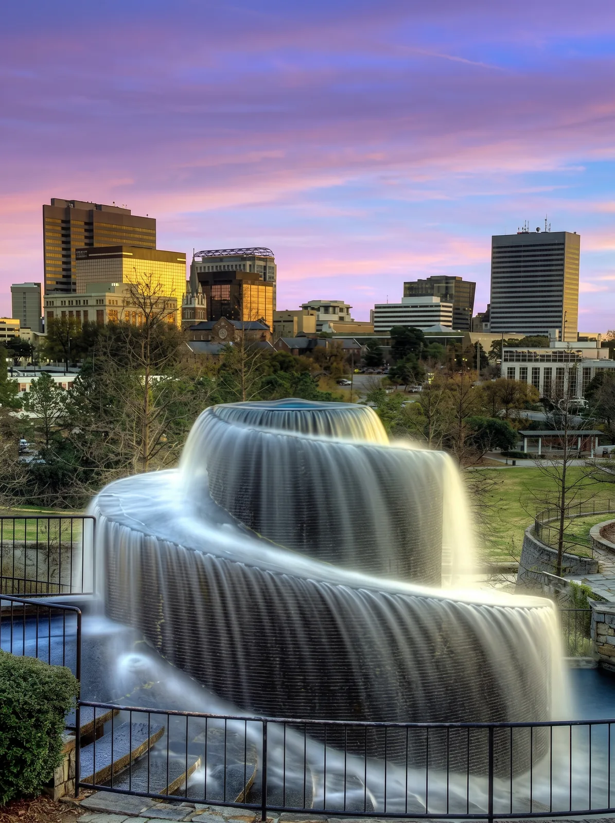 Columbia, South Carolina skyline at sunset behind the Finlay Park fountain