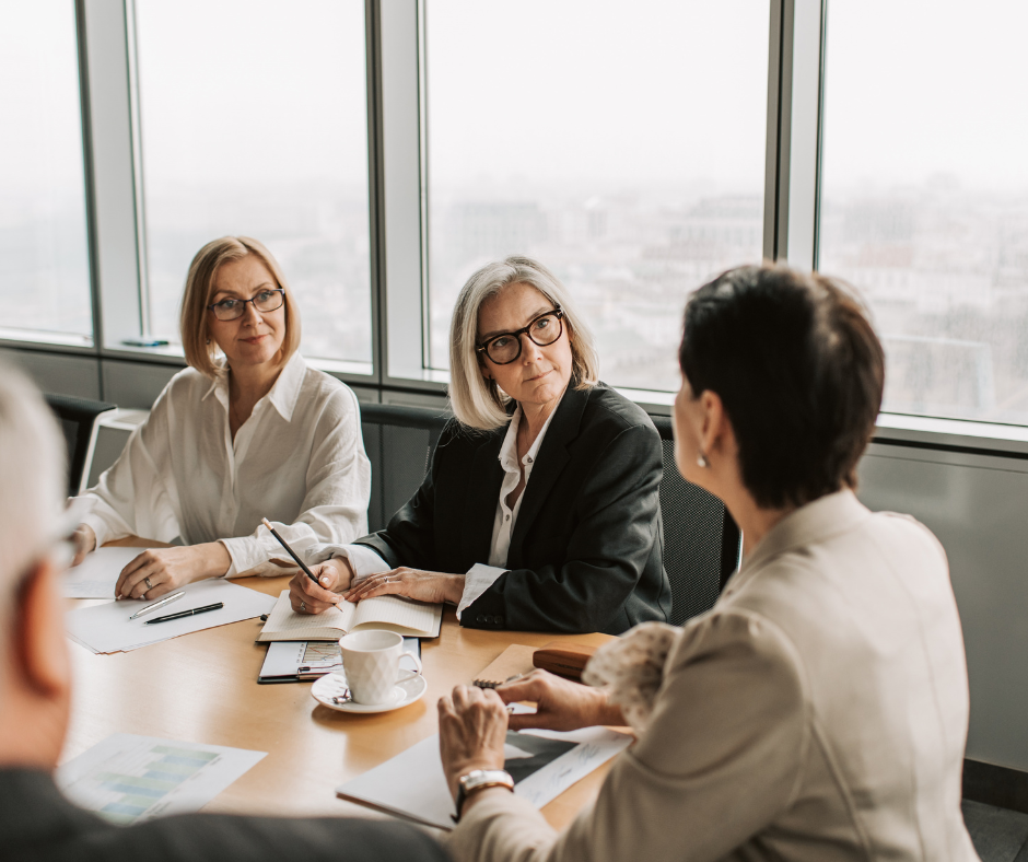Office retirement planning conversation between an HR director and a pre-retiree employee