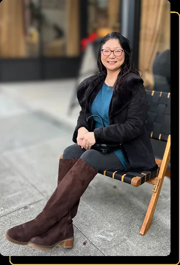 Noriko Abenojar seated outdoors