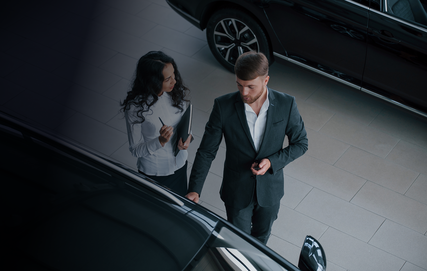 Couple exploring luxury vehicle with concierge service, LH3 Ohio chauffeur and lifestyle solutions