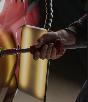 Paintless dent repair being performed on a vehicle body panel
