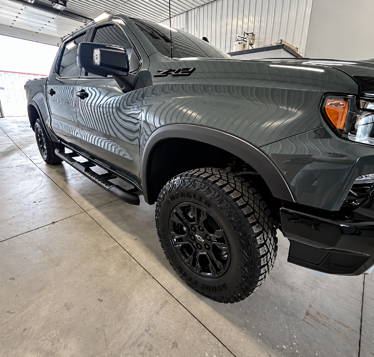 Finished gray pickup with clean exterior, wheels, and high-gloss paint