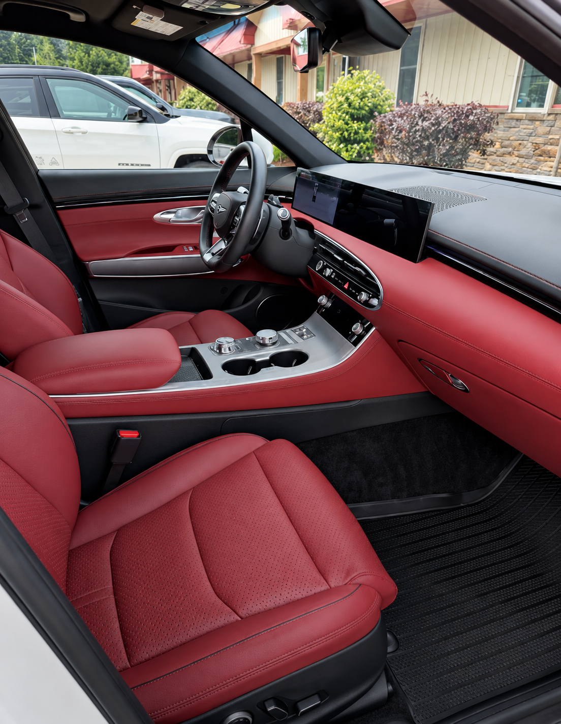 Clean red leather vehicle interior after professional interior detailing