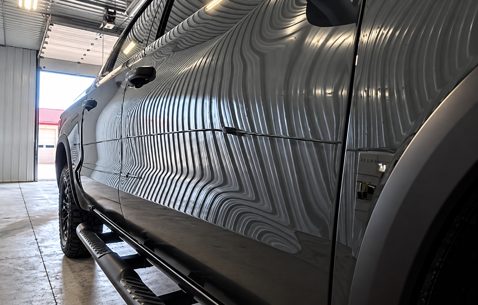 Mirror-like paint reflections showing corrected and polished automotive paint