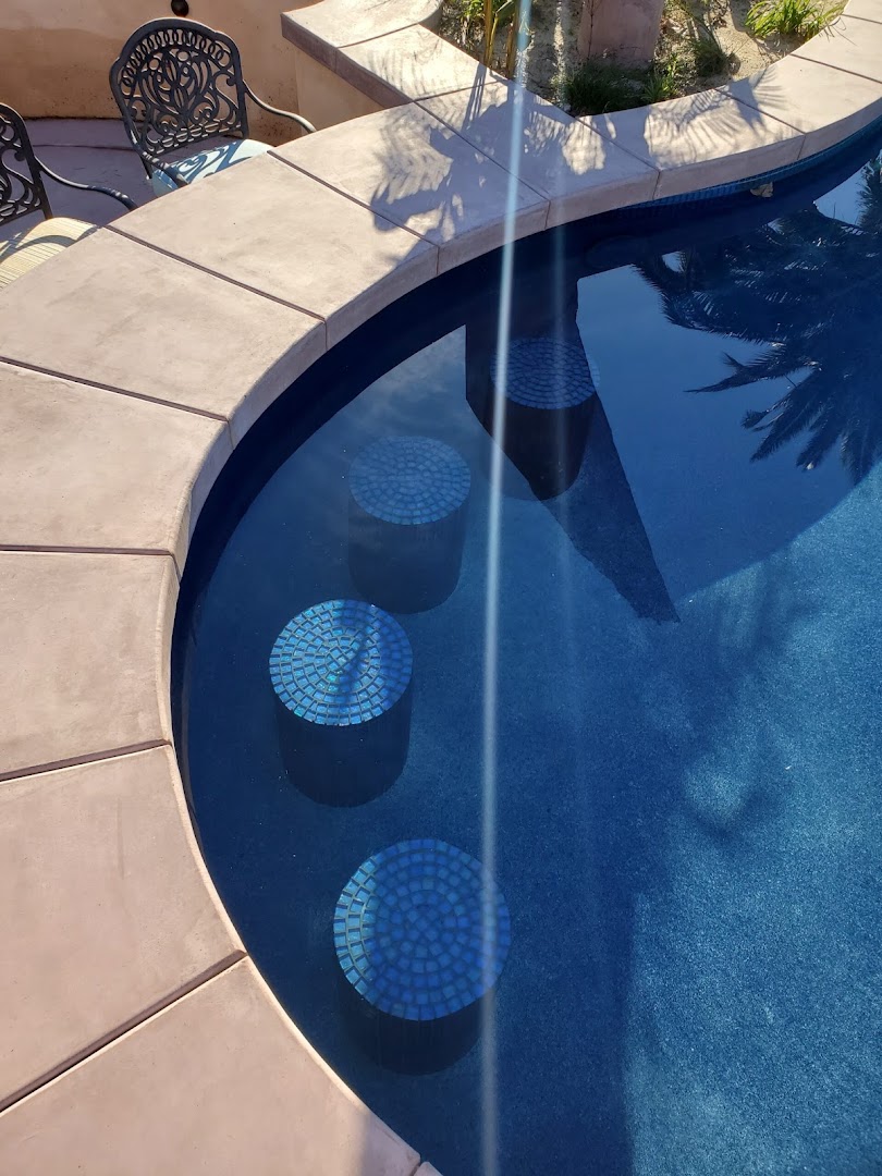 Custom mosaic tile detail in a remodeled pool