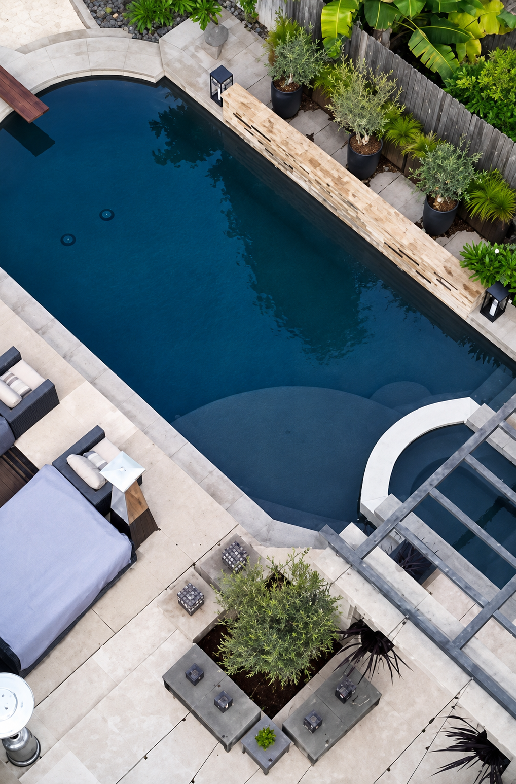 Pebble interior finish with travertine coping, San Diego pool remodel