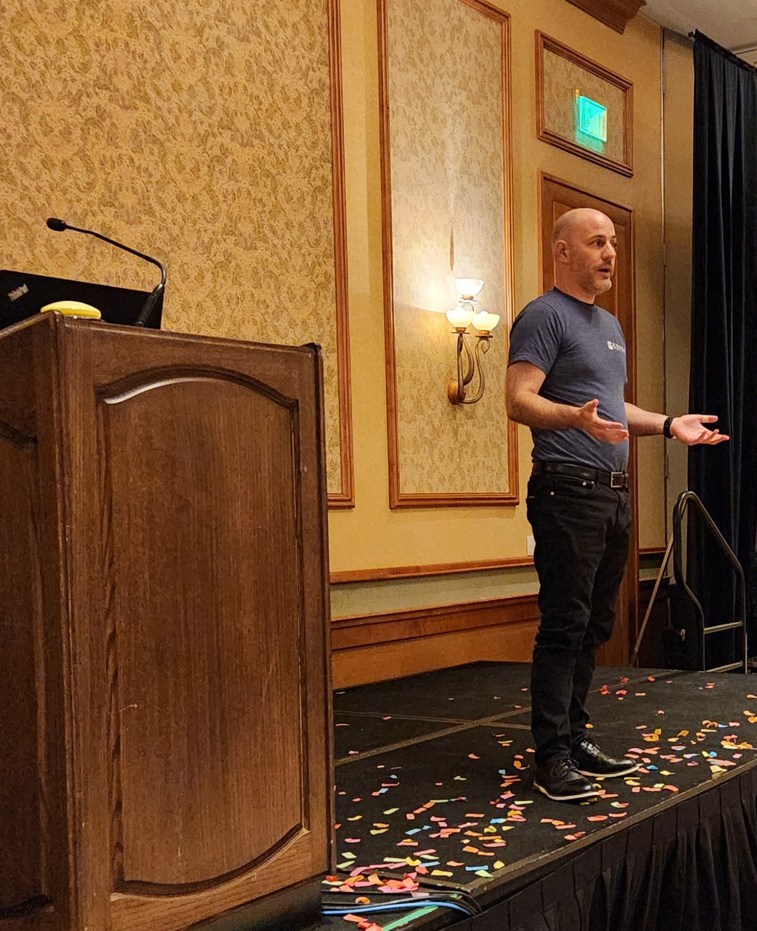 Bryan Tanner speaking on stage at a behavioral health conference