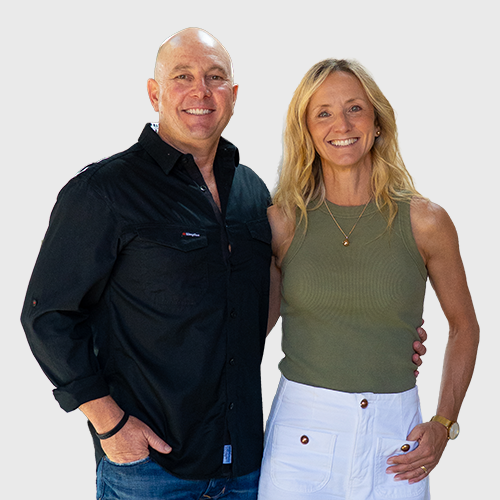Andy and Angela Smith, founders of Lifestyle Tradie, smiling and standing together