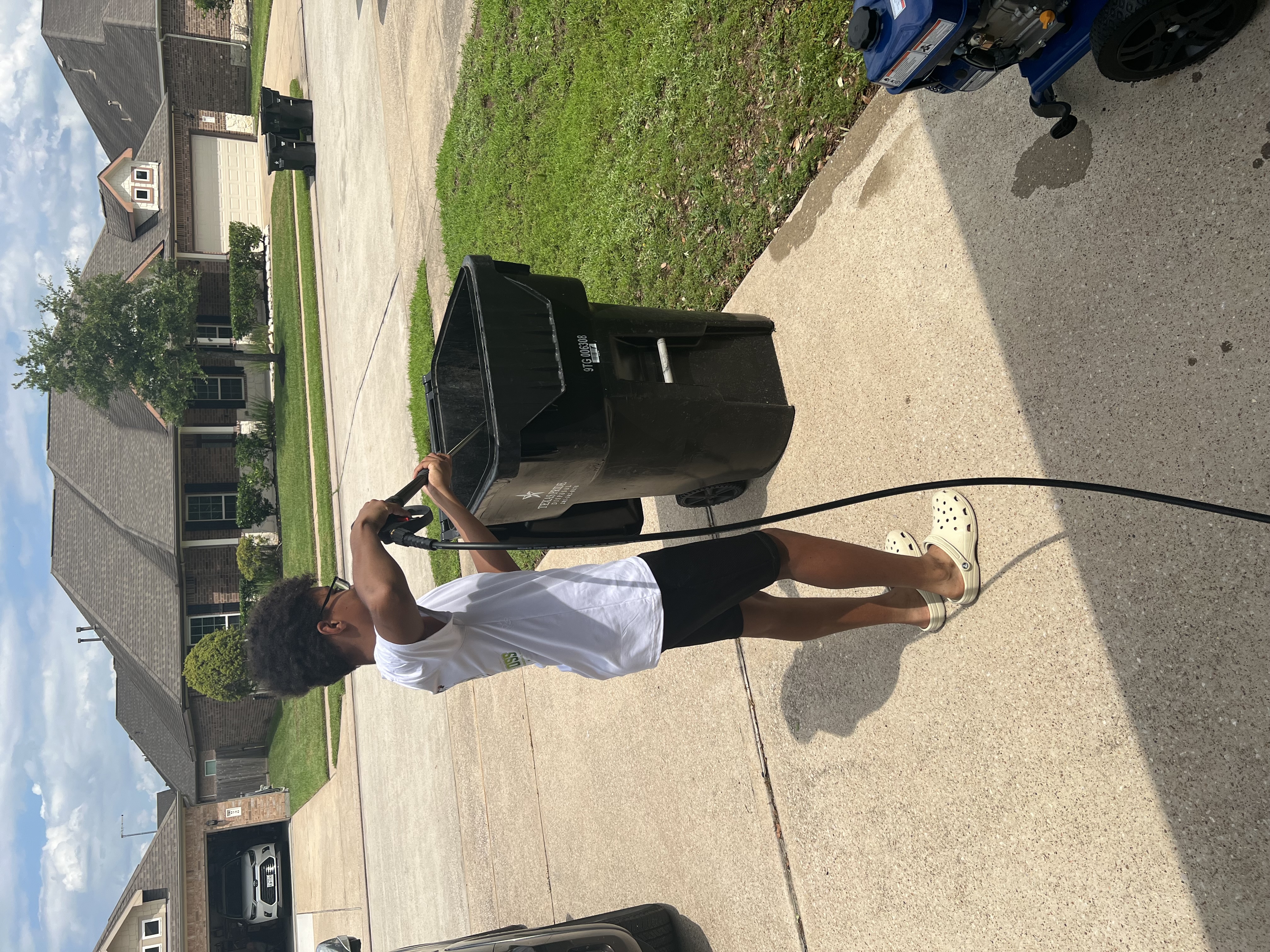 Tristin cleaning trash bin