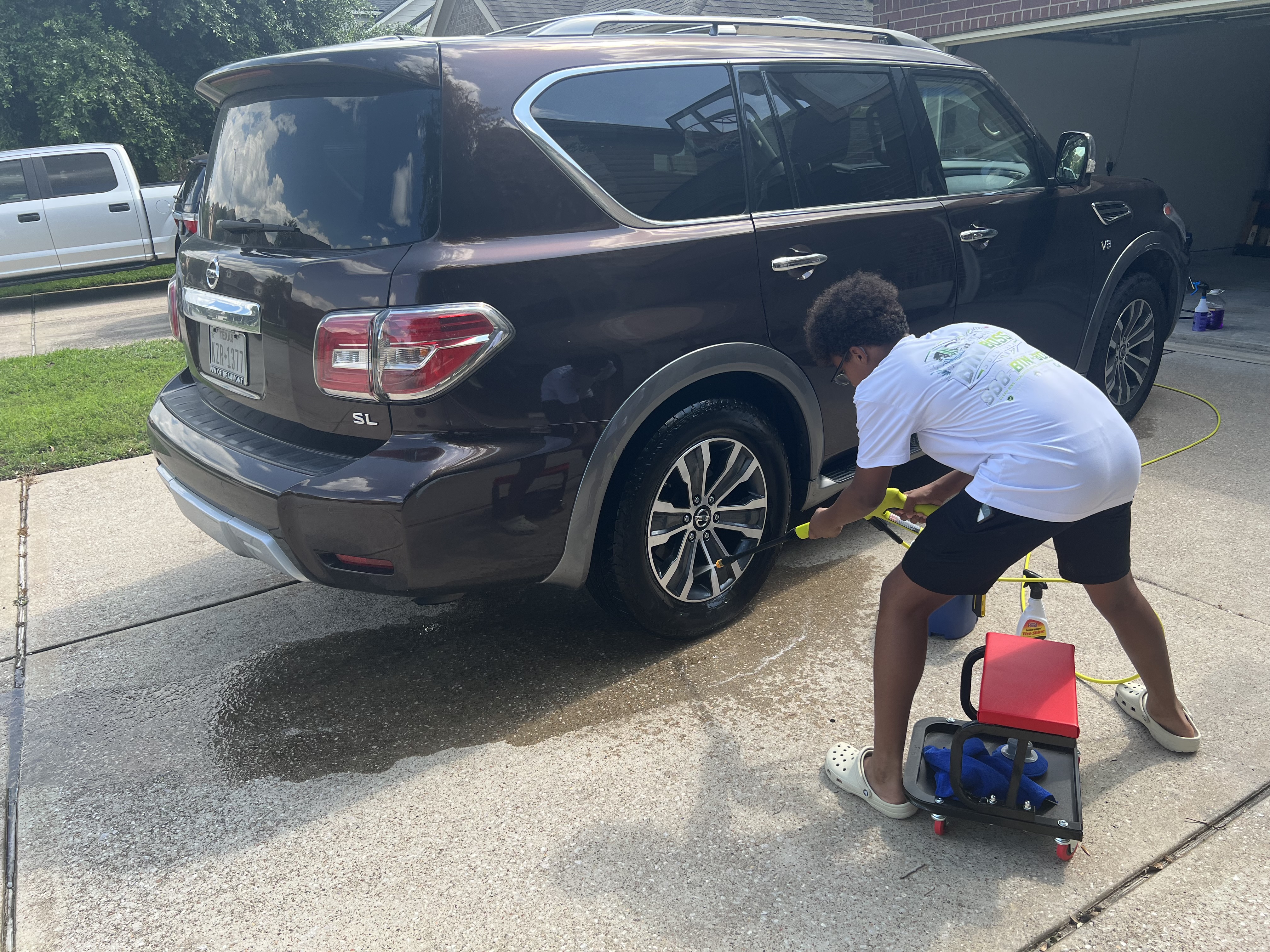 Tristin cleaning a car