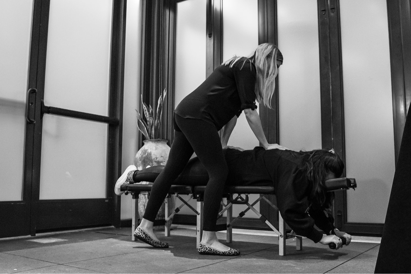 Hands-on adjusting demonstration at a ChiroIntensive training