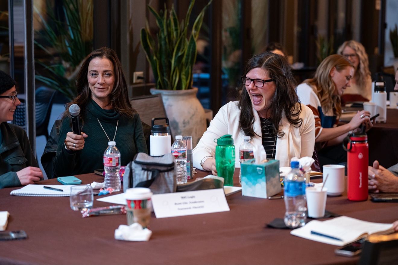 ChiroIntensive members laughing together during a session