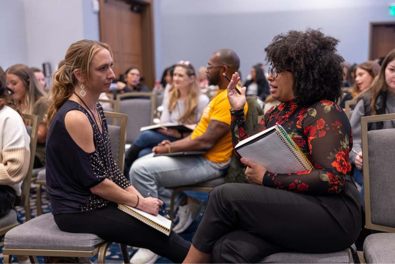 ChiroIntensive member sharing at the microphone