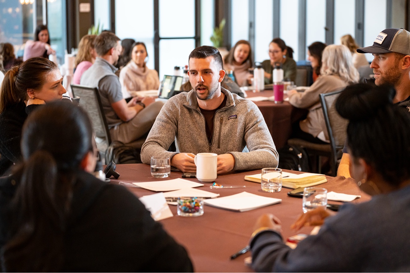 A member sharing with his table group