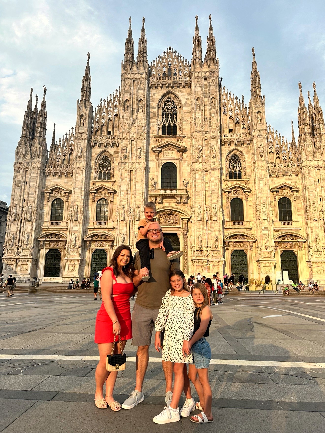 Dr. Elise with her husband and three kids traveling