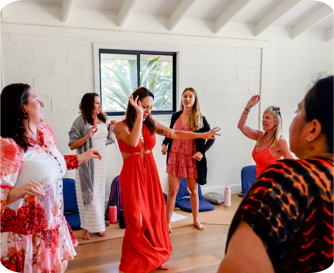 Women moving and celebrating together at the retreat