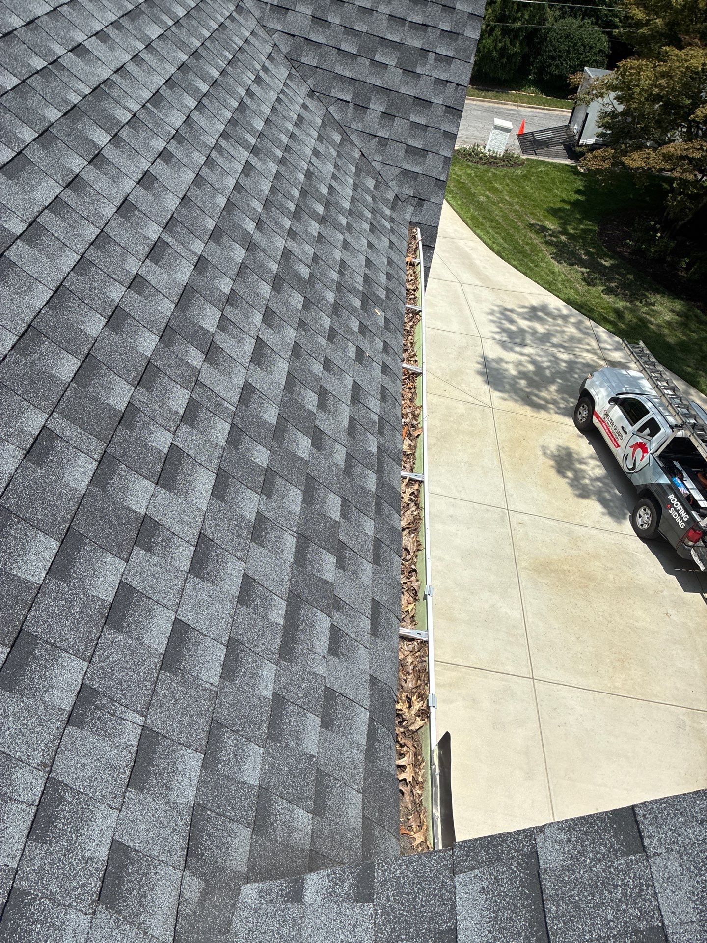 Gutter section pulled away from the fascia board on a home