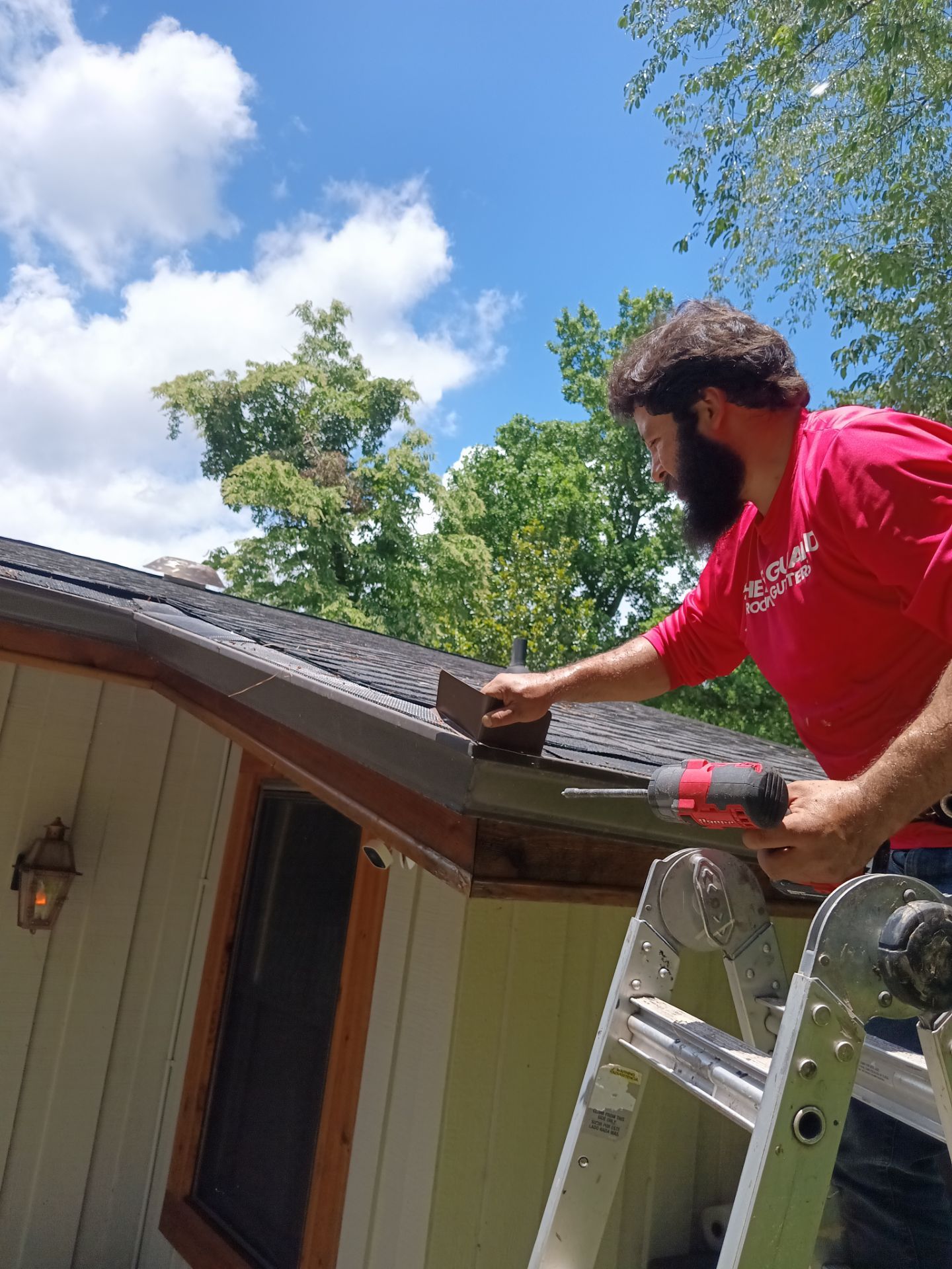 Water streaking down siding below a failing gutter
