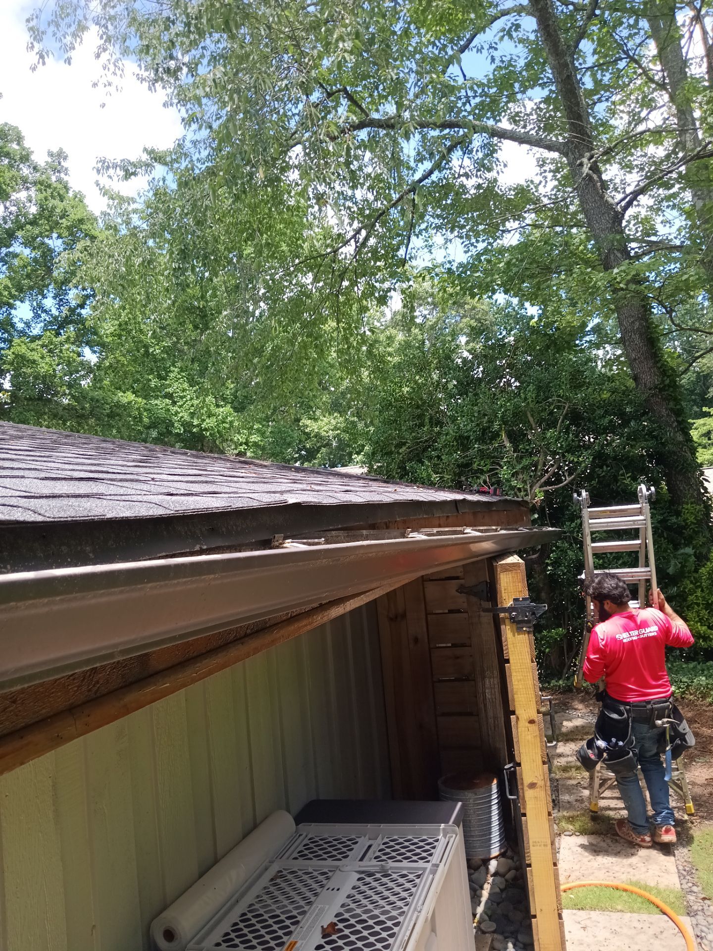 Gutter overflowing during heavy rain from debris buildup