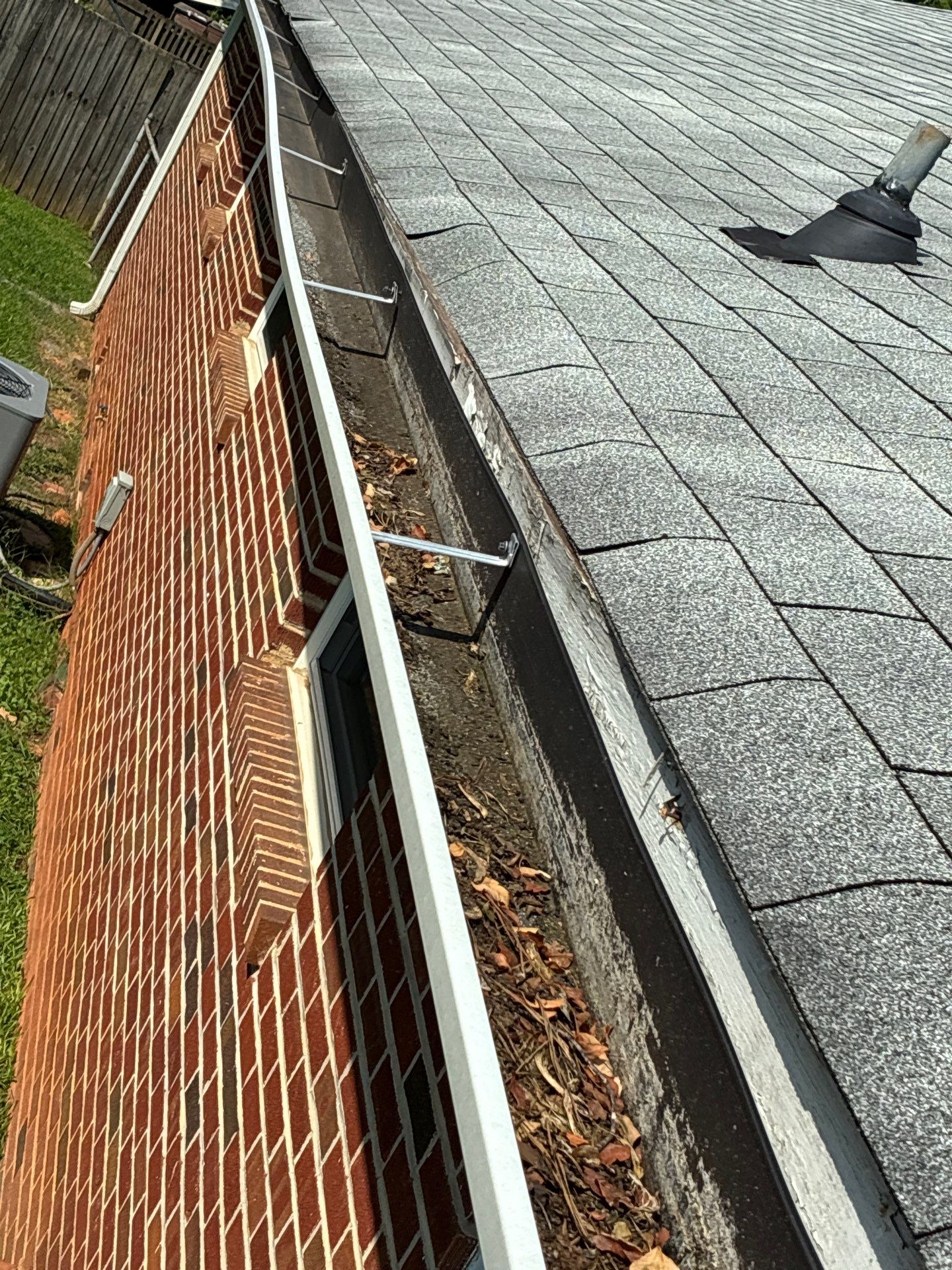 Corroded seam and fastener on an aging gutter system