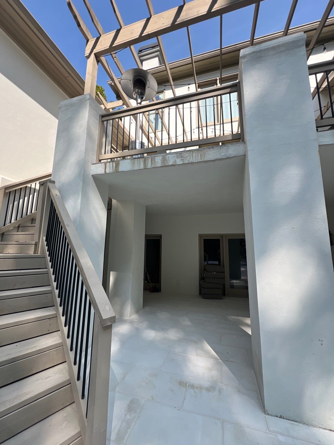 Covered patio and stairs below the gutter line