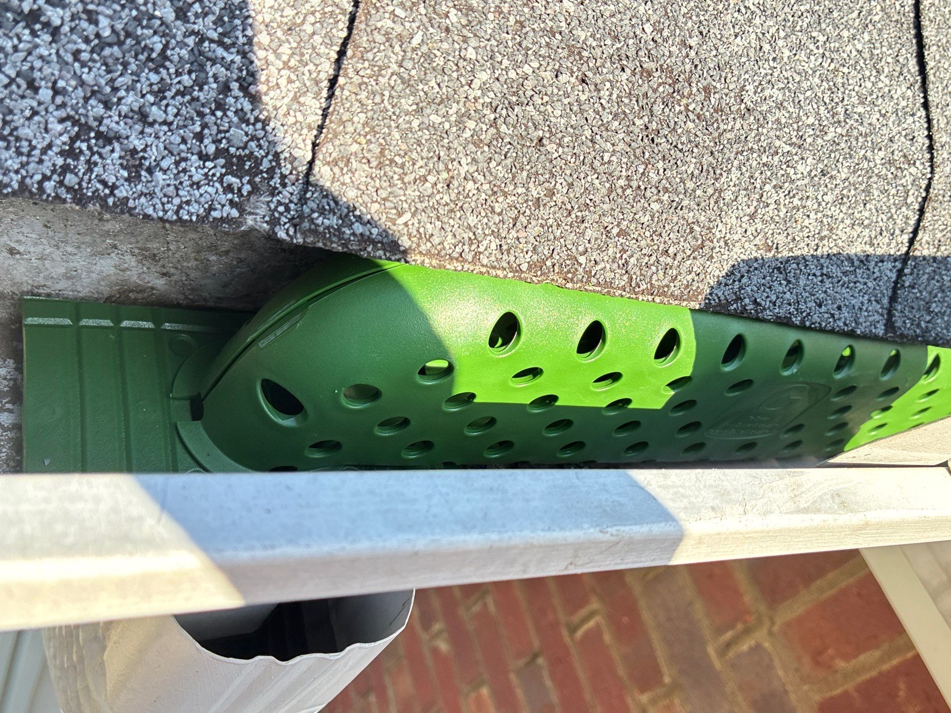 Gutter stick insert seated inside a gutter channel