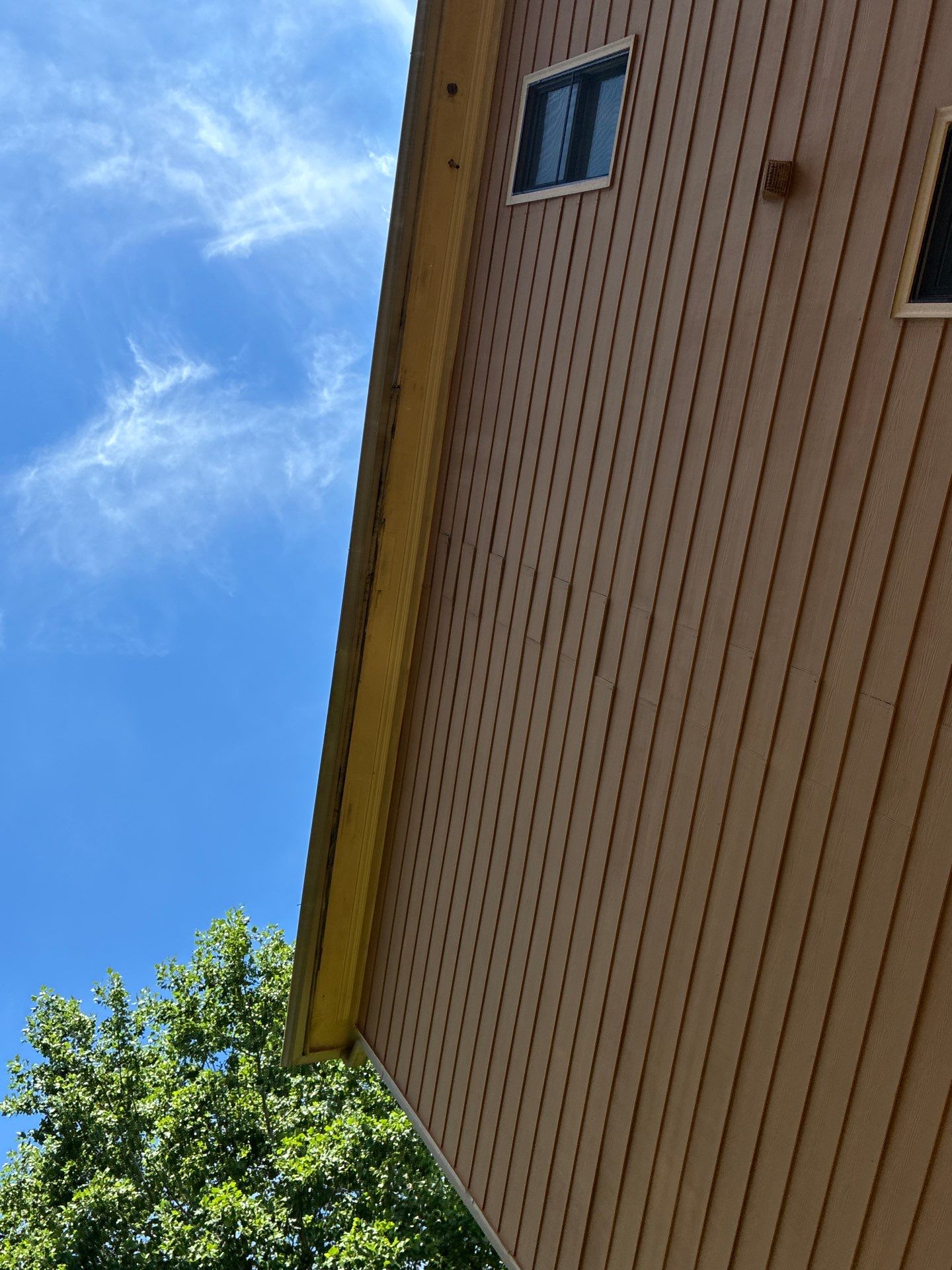 Sagging soffit panel with a visible daylight gap