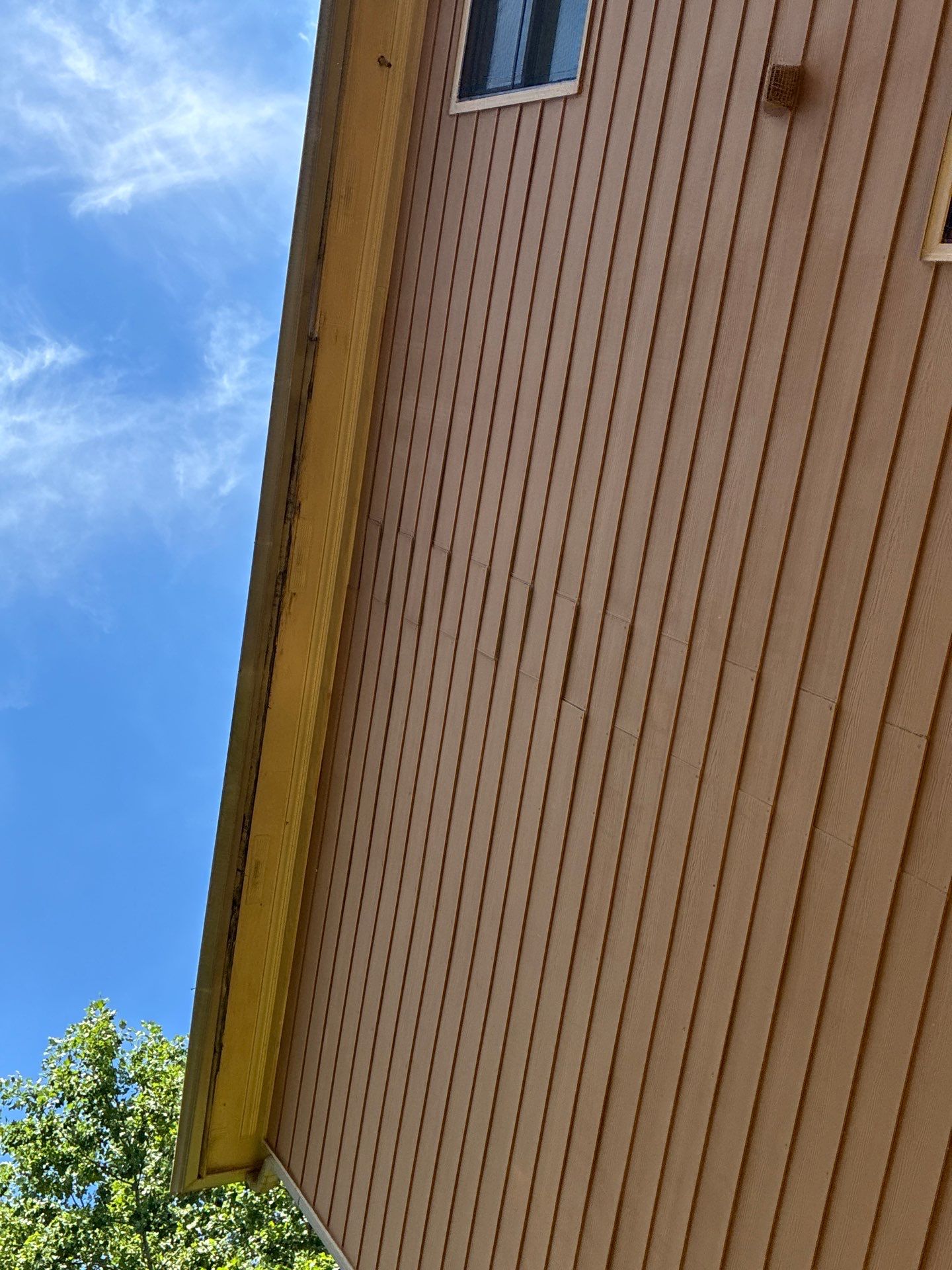 New soffit panel installed and matched to the existing vent line
