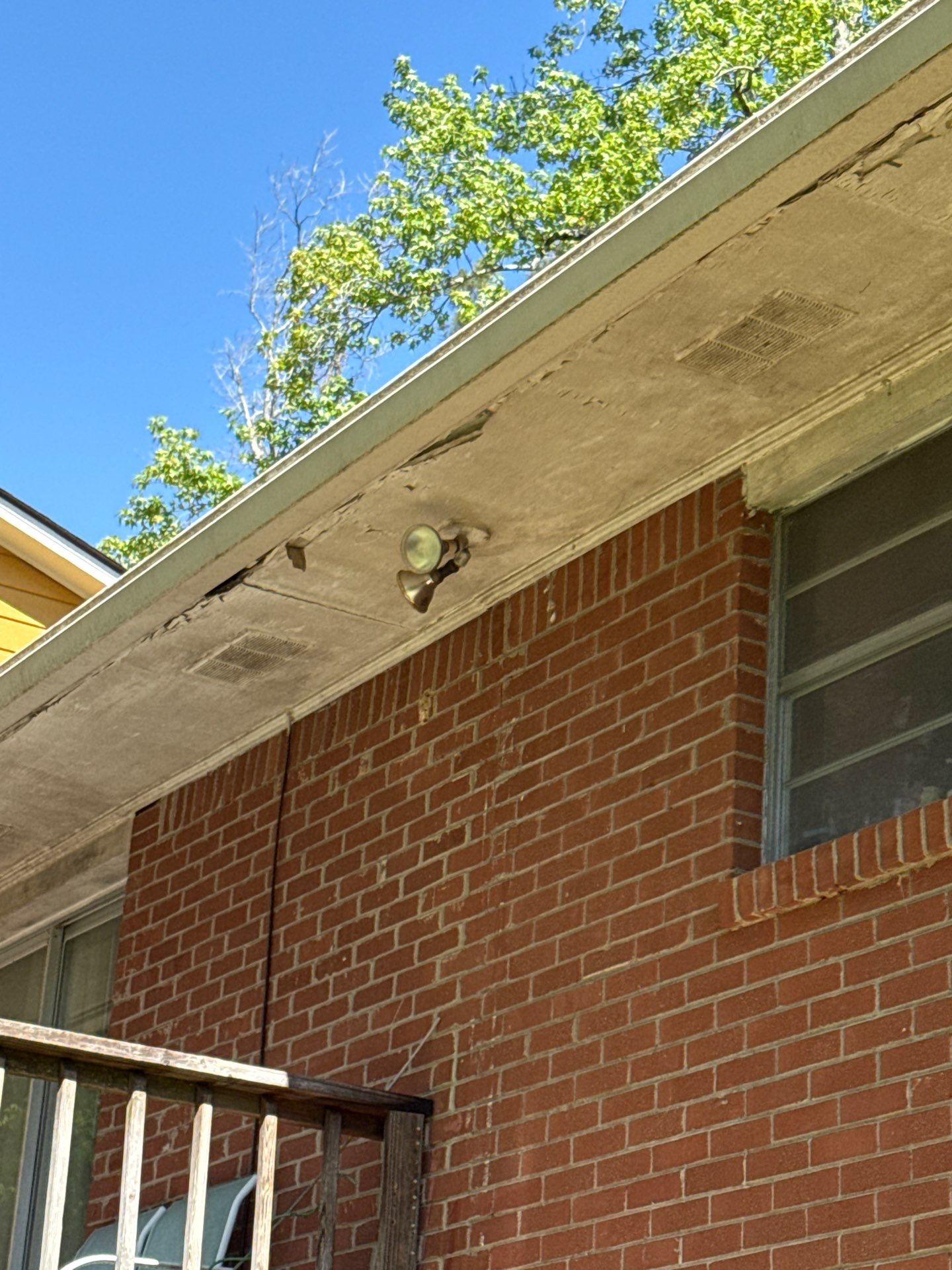 Soffit vent and fixture detail during a material inspection