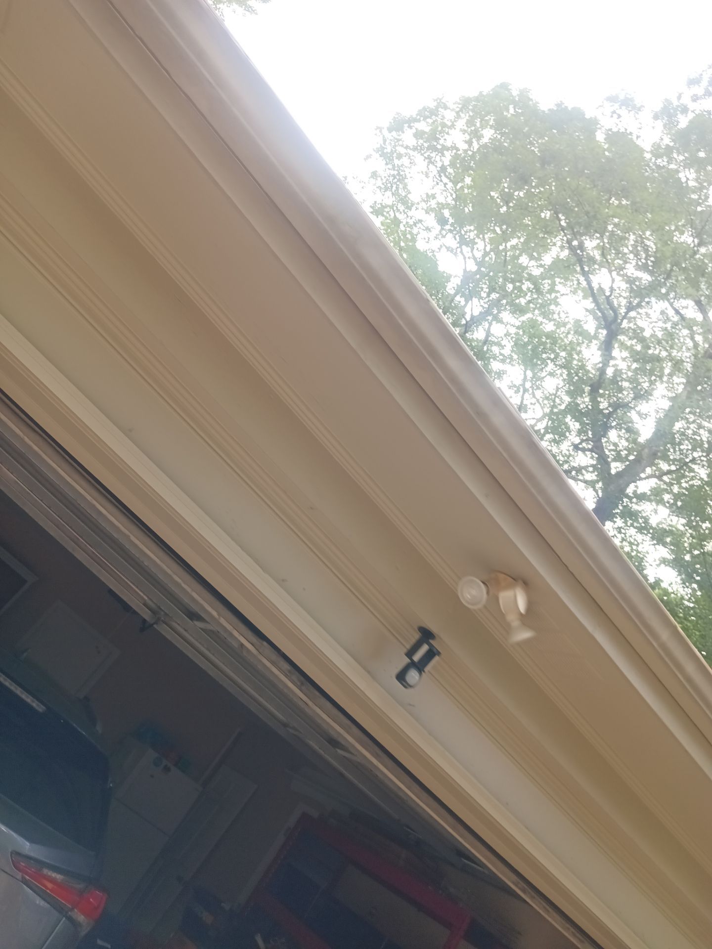 Fascia board along a roofline showing wear