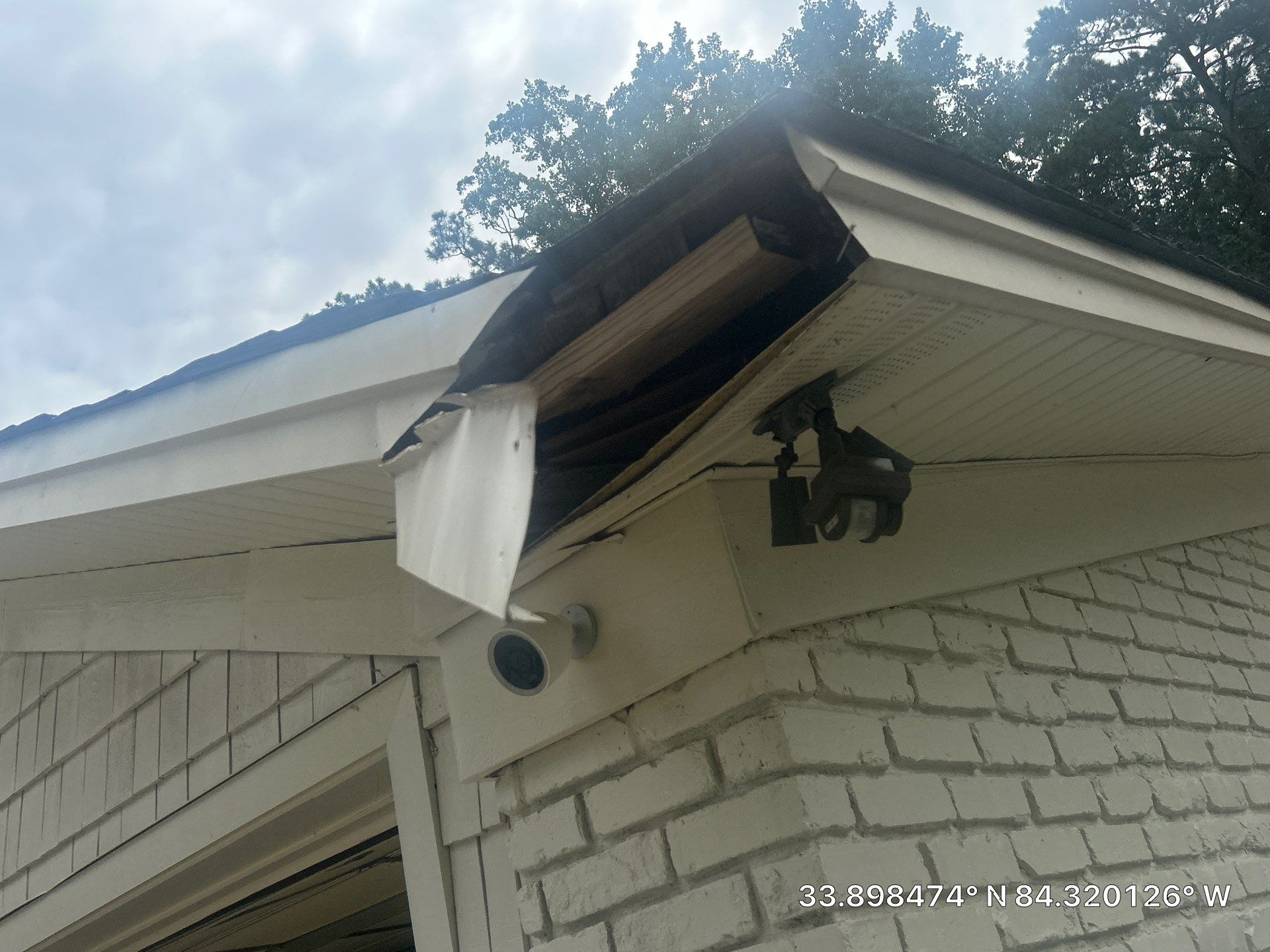 Second angle of the same rotted fascia section documented before repair