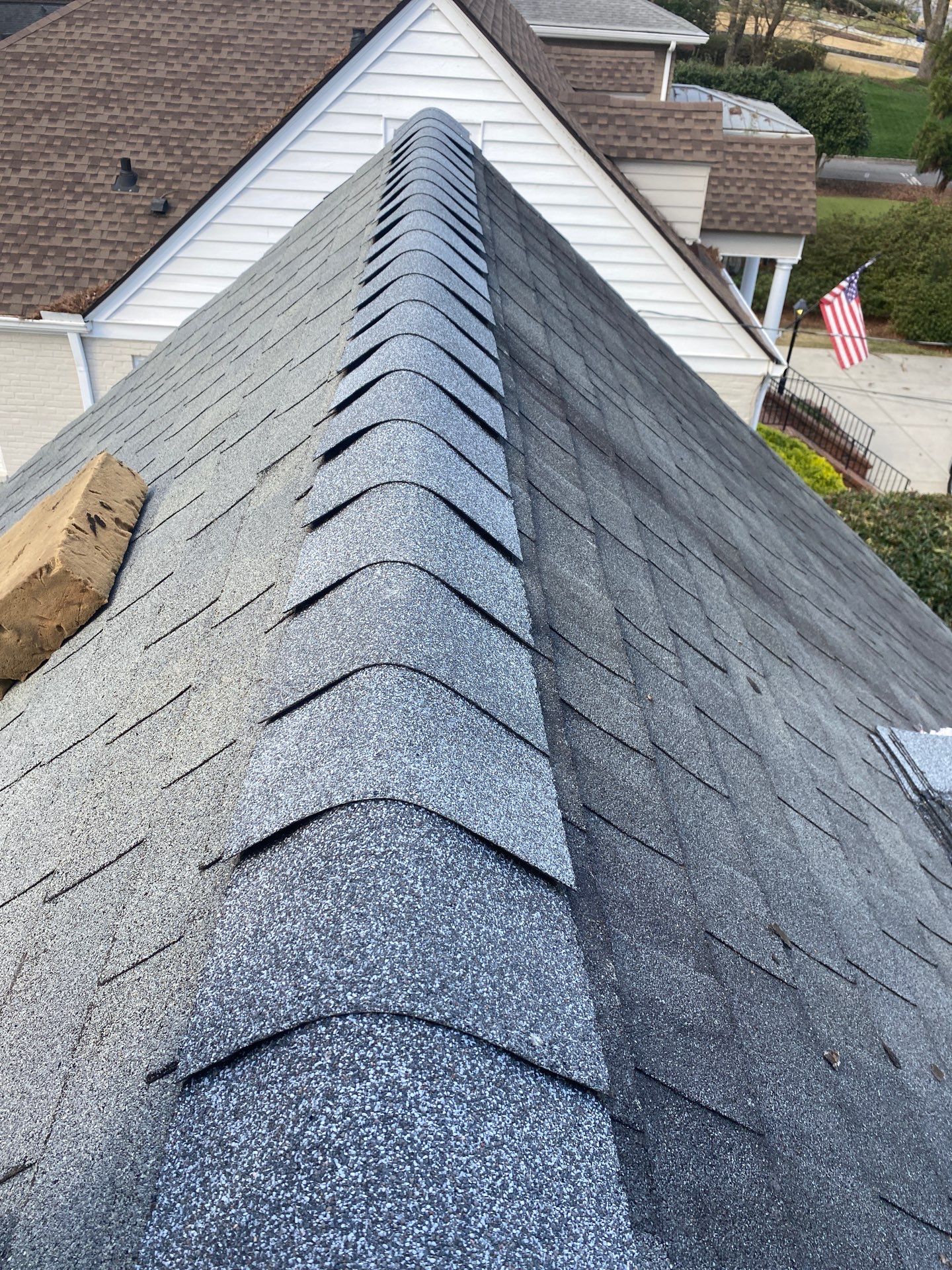 Completed ridge line after a Shelter Guard shingle repair, wide aerial view