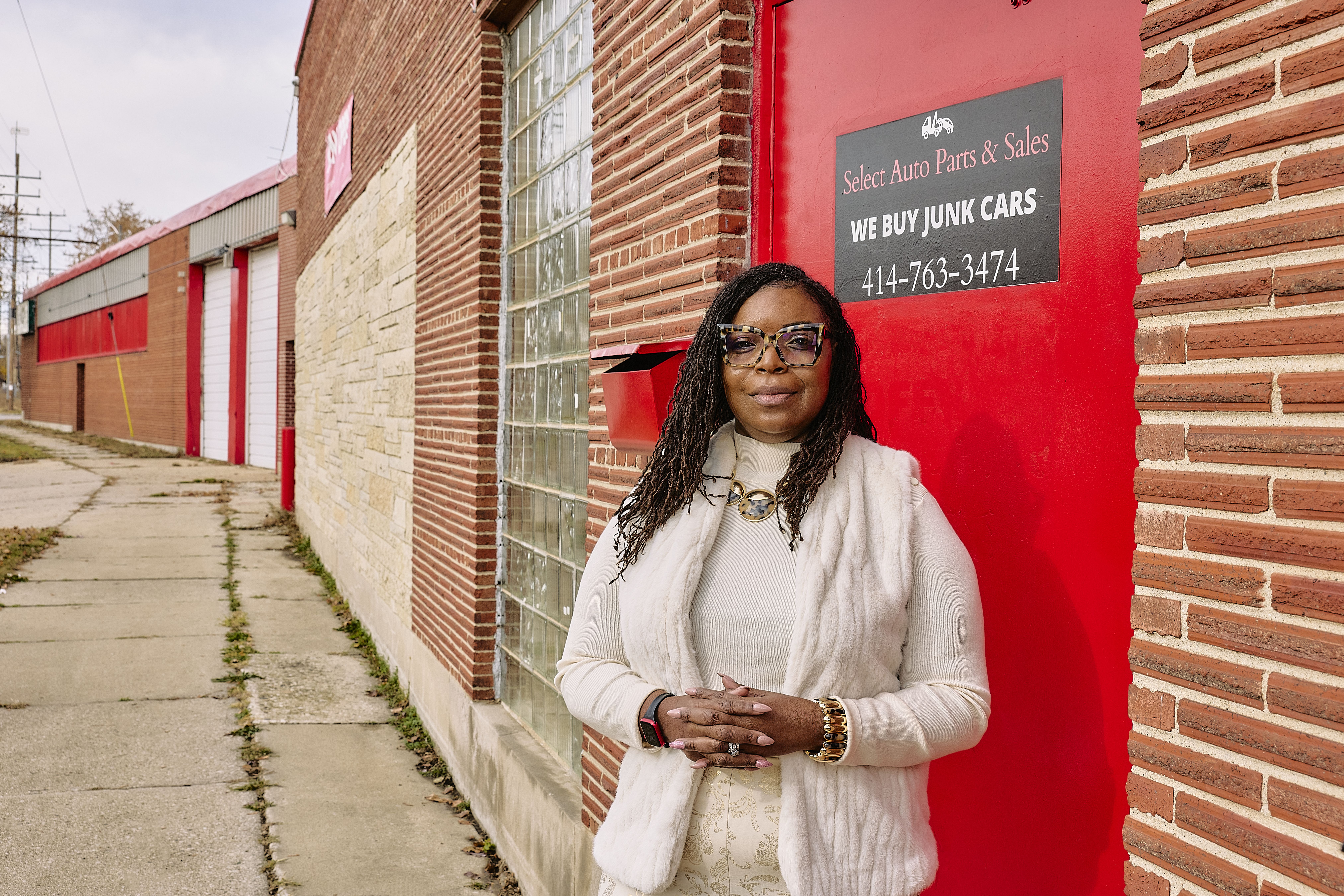 Natasha Broxton standing outside Select Auto Parts and Sales