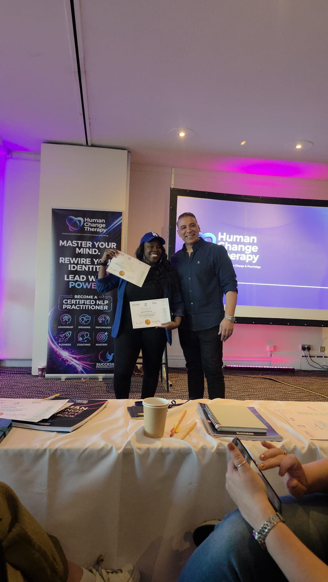 Stephanie Brown receiving her NLP Practitioner certificate