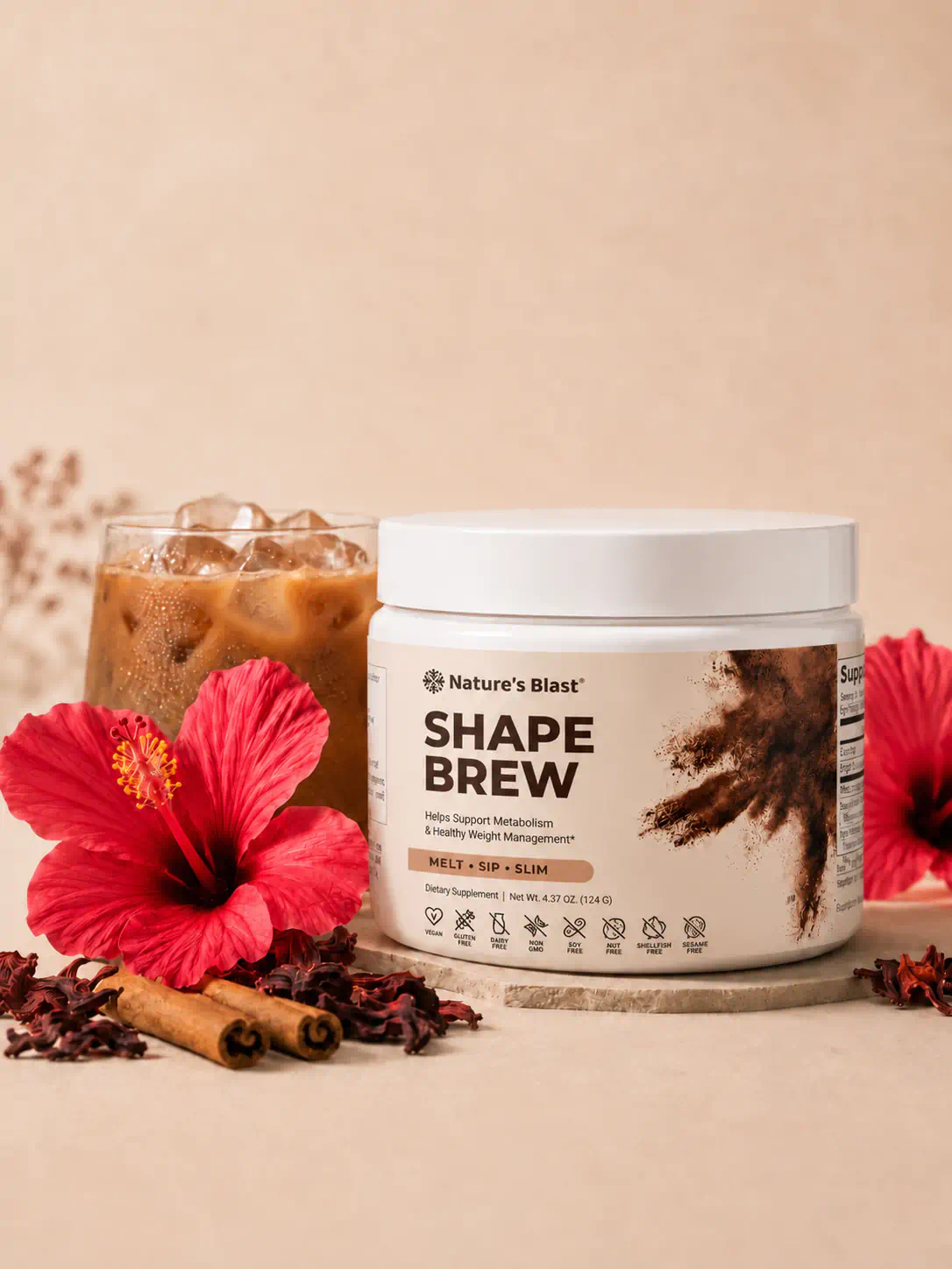 Shape Brew jar beside a glass of iced coffee, scoop mid-pour