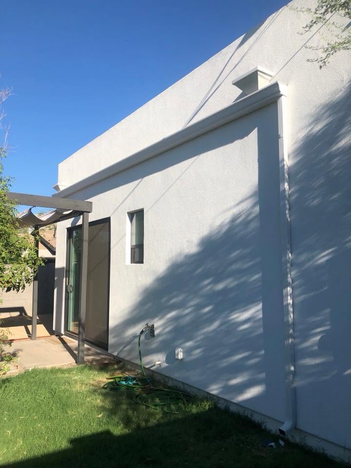 Seamless gutter on a contemporary white stucco Phoenix home