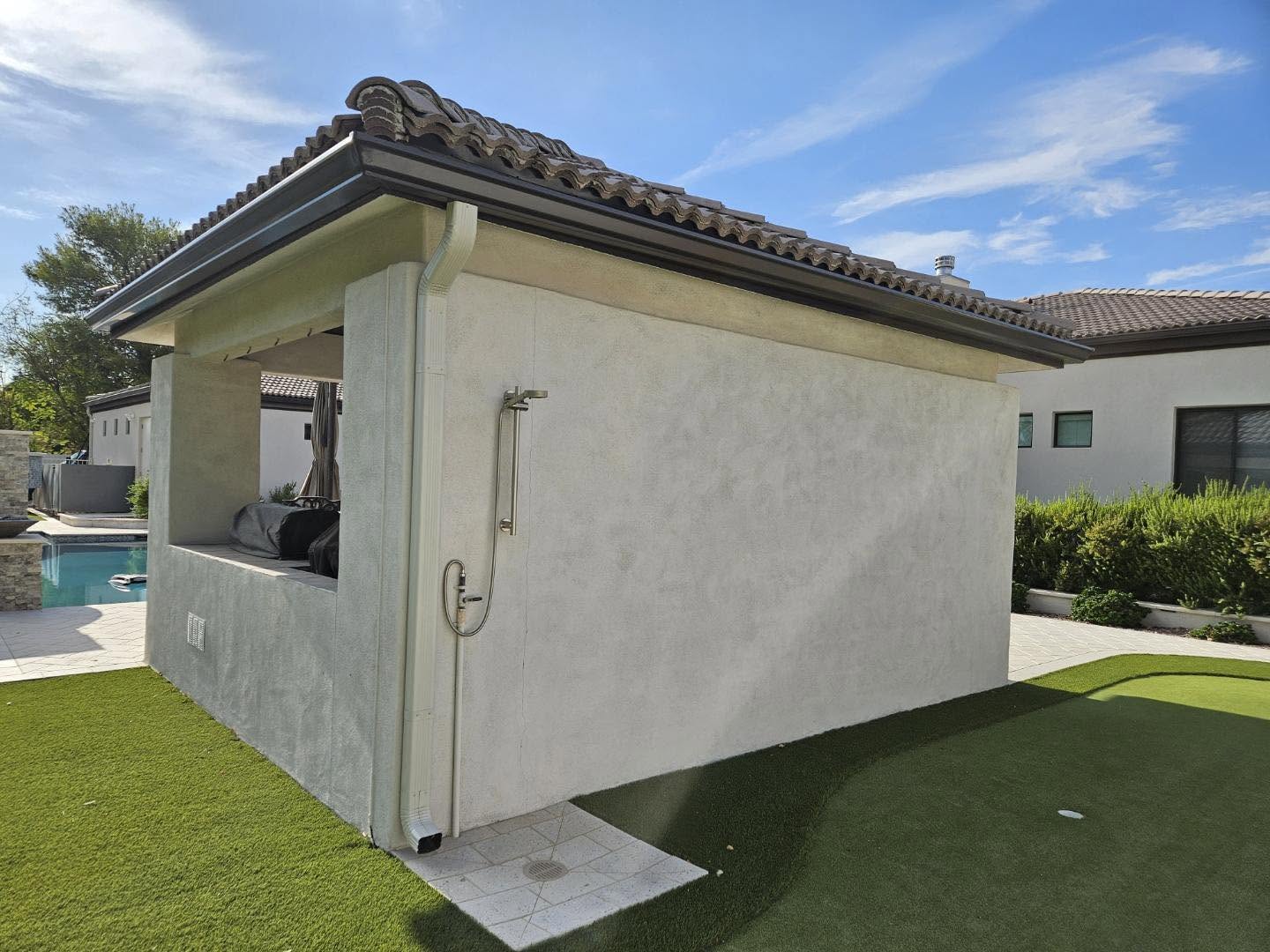 Seamless gutter along the roofline of a two story tile roof home