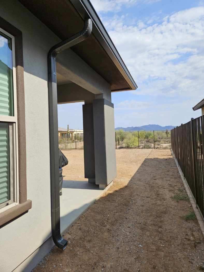 Seamless gutter along a covered patio with an open desert view