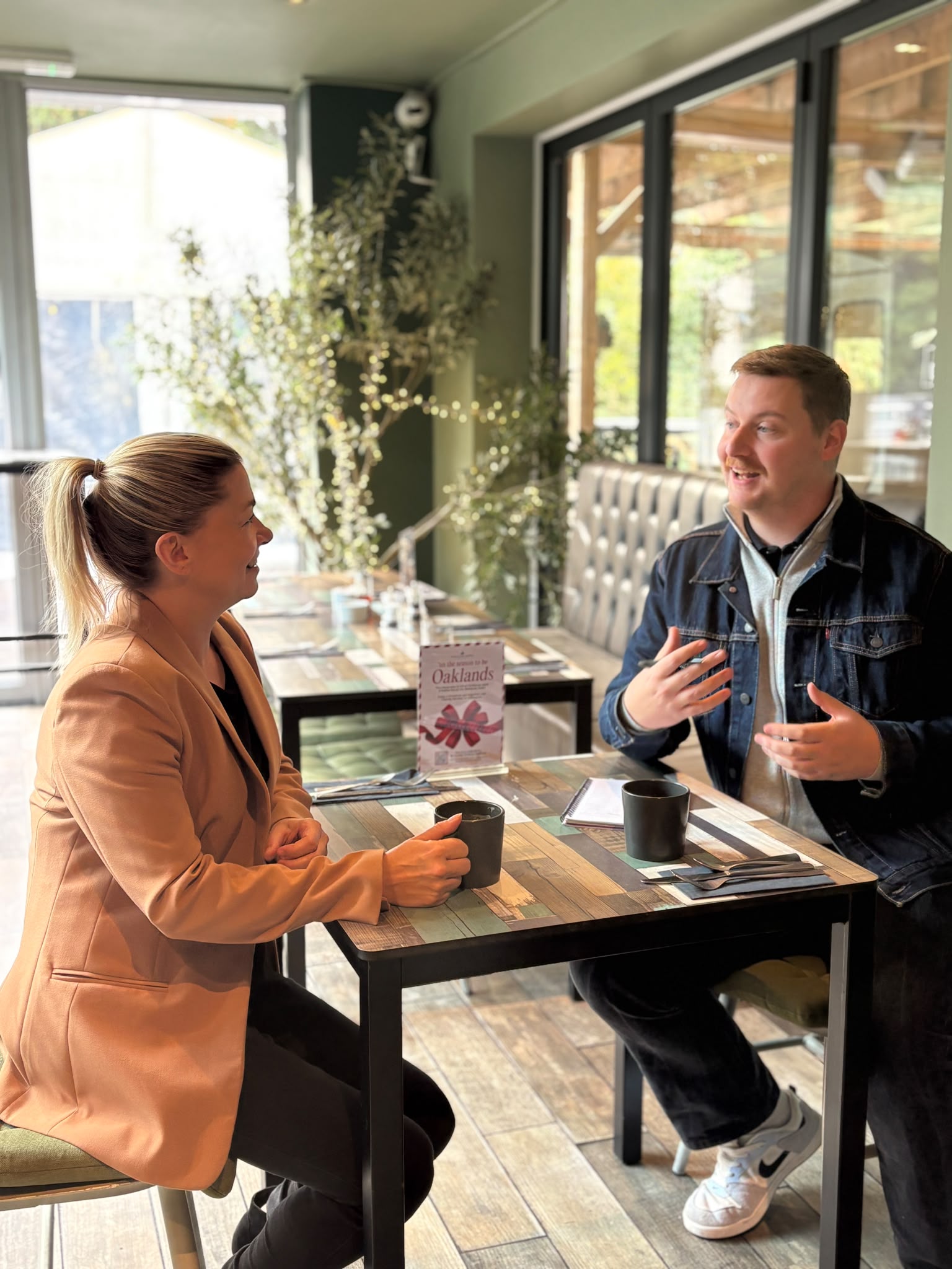 Sarah Jones meeting a hospitality business owner over coffee