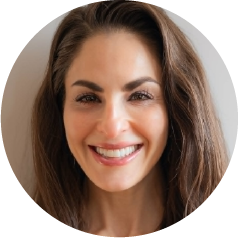 Kyra Harrison, Board Certified Physician Assistant at Novus Anti-Aging Center, smiling with dark hair and a white coat, representing personalized care and expertise in health services.