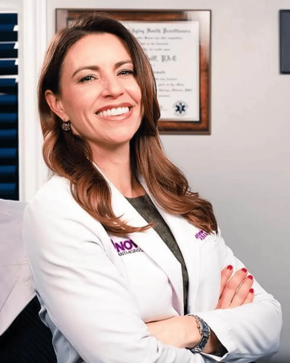 Stephanie Wolff, PA-C, a board-certified specialist in hormone optimization and peptide therapy, poses confidently in her Studio City office.