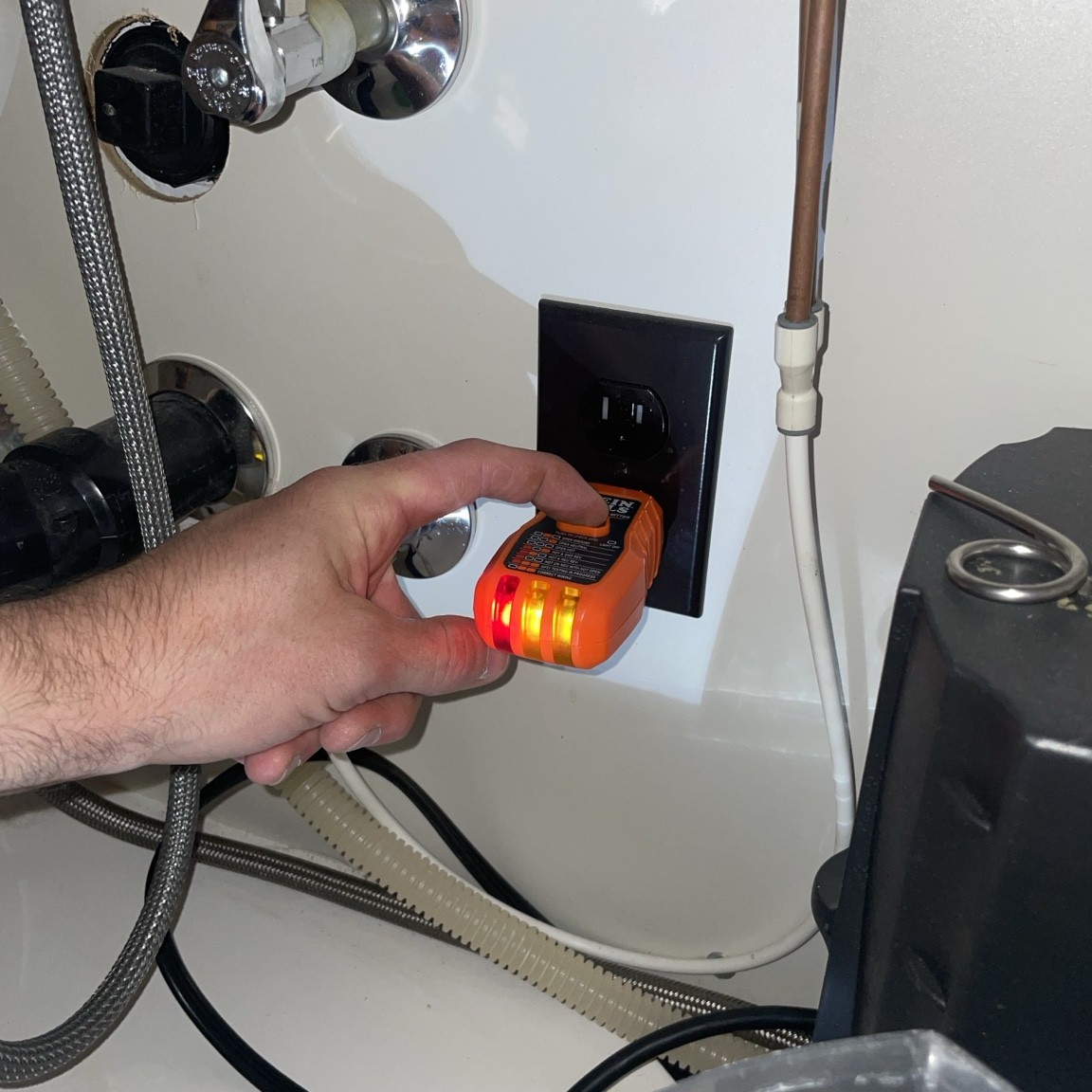 Tester at the laundry outlet and the kitchen disposal outlet under the sink. Neither tripped when tested. Tester at the laundry outlet and the kitchen disposal outlet under the sink. Neither tripped when tested.